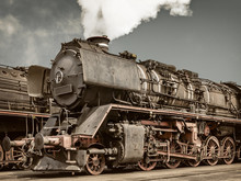 Retro Styled Image Of An Old Steam Locomotive