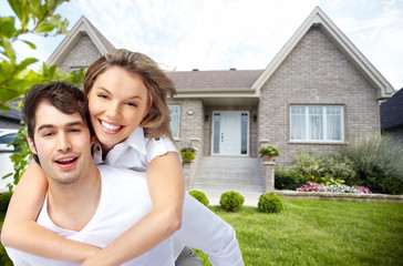 Canvas Print - Happy couple near new house.