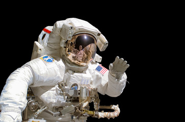 Wall Mural - close up of an astronaut isolated on black background - elements of this image are provided by nasa
