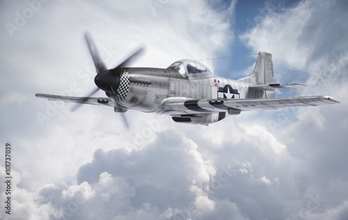 Fotomural World War II era fighter flies among clouds and blue sky