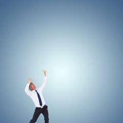 Poster - Composite image of businessman with hands raised 