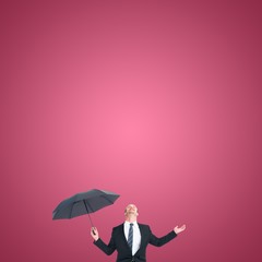 Canvas Print - Composite image of businessman sheltering under black umbrella