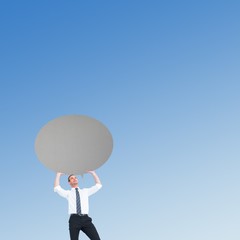 Canvas Print - Composite image of businessman holding a speech bubble