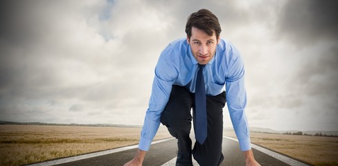 Poster - Composite image of focused businessman ready to race