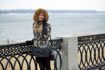 Wall Mural - Young beautiful blonde woman in fur hood