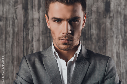 Attractive Man In Business Suit On The Grey Background Buy This
