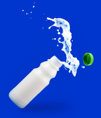 Wall Mural - Pouring milk in a  bottle on blue background