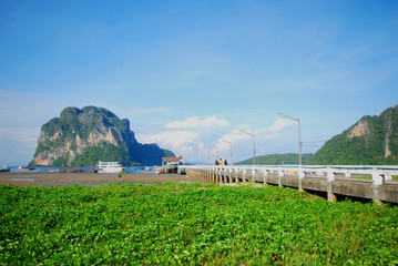 Bridge for walk to the sea with mountain view