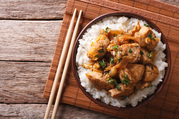 Wall Mural - Traditional oyakodon and rice in a bowl. horizontal top view
