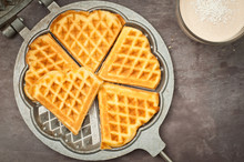 Home Made Heart Shaped Waffles Served In A Traditional Cast Iron Waffle Pan With A Healthy Peanut Butter Banana Smoothie Milkshake.