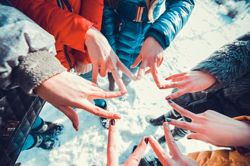 Hands of young people in the winte