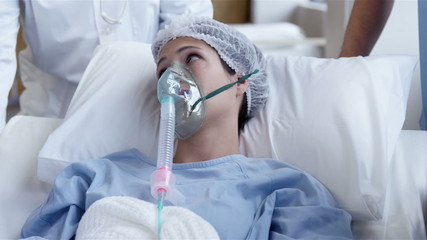 female patient receiving artificial ventilation