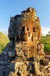 Enigmatic face-tower of Bayon temple in evening sun. Cambodia