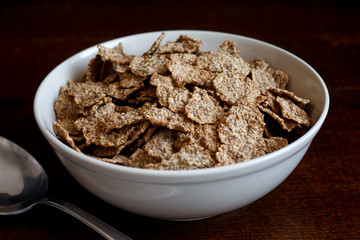 Wheat bran breakfast cereal in bowl.