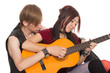 © Stanislav Komogorov - Boy teaches girl to play the guitar