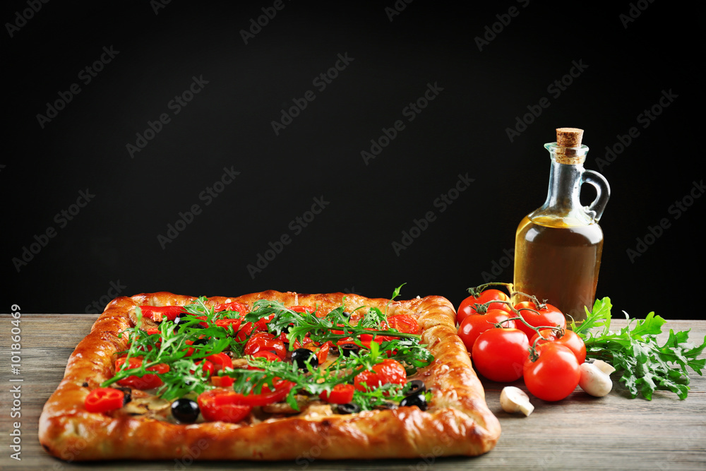 Freshly homemade pizza on black background