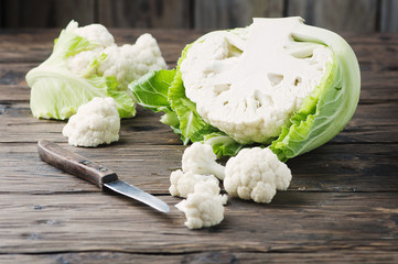 Fresh raw cauliflower on the wooden table