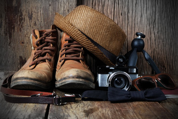 Wall Mural - Shoe hat and accessories travel set on a wooden background