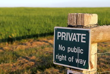 PRIVATE No Public Right Of Way Sign, On A Field Gate In The Evening Sun.