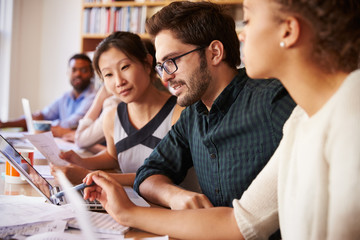 Business Team Having Meeting In Busy Office