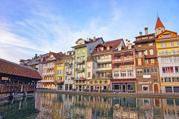 Canvas Print - City Church and Bridge at Embankment in Thun Old City in Switzerland