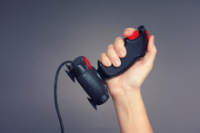 Person Holds Retro Joystick In Her Hand