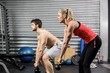 © WavebreakmediaMicro - Couple lifting dumbbells together