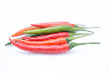 red chilies or chilli cayenne peppers isolated on white backgrou