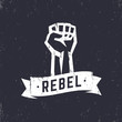 Rebel, grunge t-shirt design, print, fist held high in protest, white over dark, vector illustration
