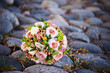 The bride's rose bouquet on the stones