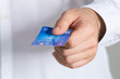 © Andrey Popov - Businessman Holding Credit Card