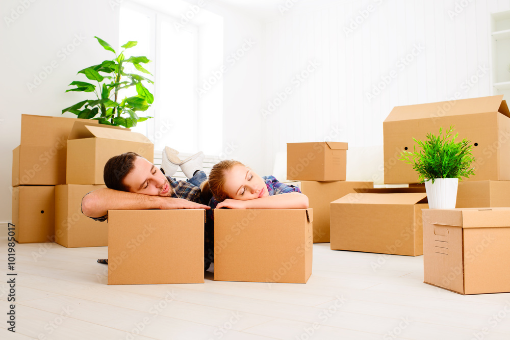 moving to a new apartment. tired family couple and cardboard box Stock ...