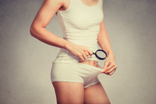 Attractive Slim Woman Looking With A Magnifying Glass On Her Pubic Hair On The Crotch