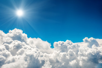 Wall Mural - blue clouds, sun and sky