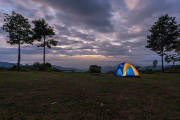 illuminated blue camping tent at night