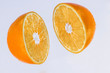juicy orange is cut into two parts
