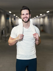 Wall Mural - Jogger resting after running. Man runner taking a break during t