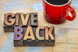 give back word abstract in wood type