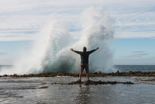 Man In Front Of Splashing Wave