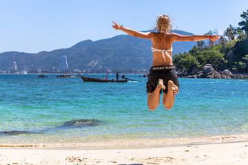 Wall Mural - Happy woman jumping 