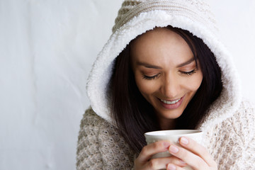 Wall Mural - Beautiful young woman drinking coffee