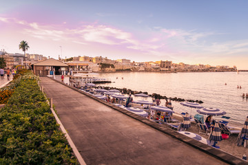 Wall Mural - Sunset on the seafront at Otranto in southern Italy.