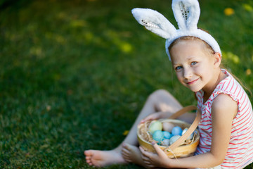 Wall Mural - Little girl with Easter eggs