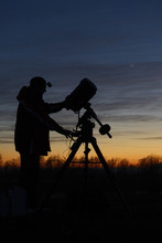 Amateur Astronomer With His Telescope