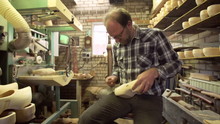 Clog Maker Is Cutting Decoration In Clog With A Gouge