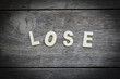 © buraratn - The word lose on the wooden floor