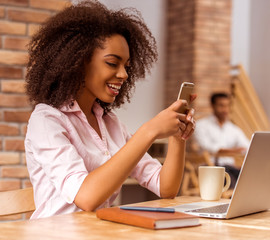 Beautiful Afro-American woman working