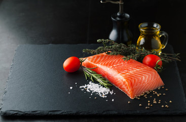 Wall Mural - Fresh salmon with spices, herbs, rosemary and olive oil