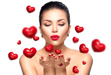 Beauty Woman With Perfect Makeup Blowing Valentine Hearts