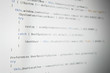 © kavzov - Software developer programming code. Abstract computer script code. Shallow depth of field, selective focus effect.